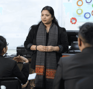 A lady Trainer giving training in the class 