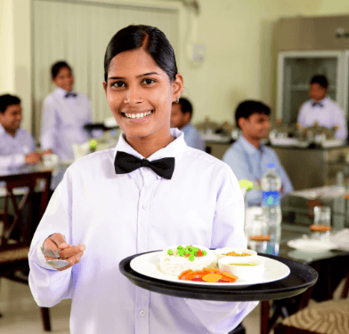 A chef showing her skills to students